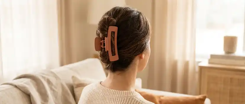 Woman with thick hair styled with a large claw clip